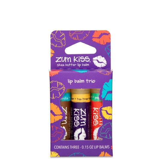 Purple box decorated with multicolored lips that contains 3 Zum Kiss lip balms in various flavors.