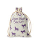 Muslin bag with purple goats filled with soap shavings.