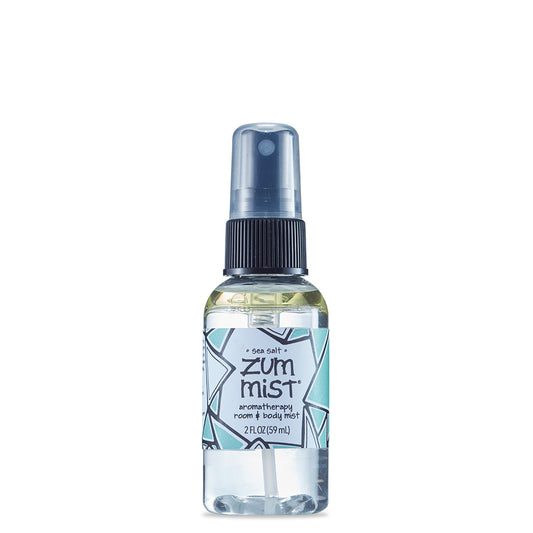 Small round bottle with black sprayer containing sea salt scented room and body mist