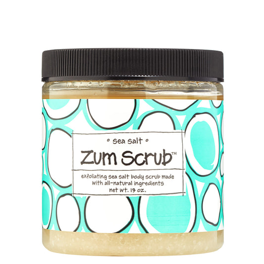 Clear jar with screw lid and blue label containing sea salt scented salt body scrub.